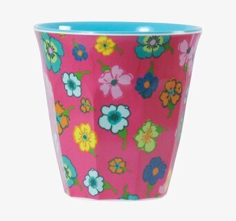 Bild av färgglad mugg med blommönster och turkos insida