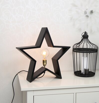 LYSeKIL Stjärna Svart från Star Trading på vit byrå