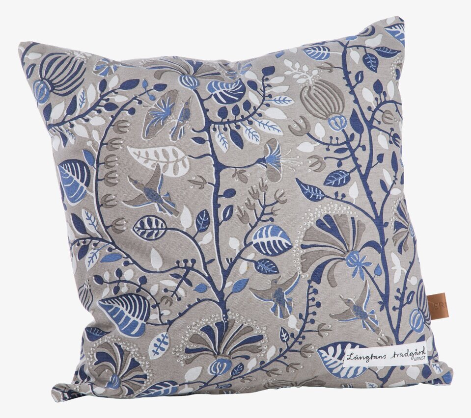 Kudde Längtans Trädgård Beige/Blå från Ernst i soffa