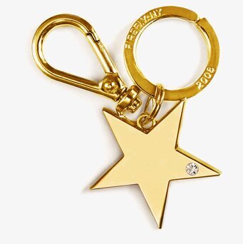 Bag Charms Star Gold från Firefly på vit bakgrund