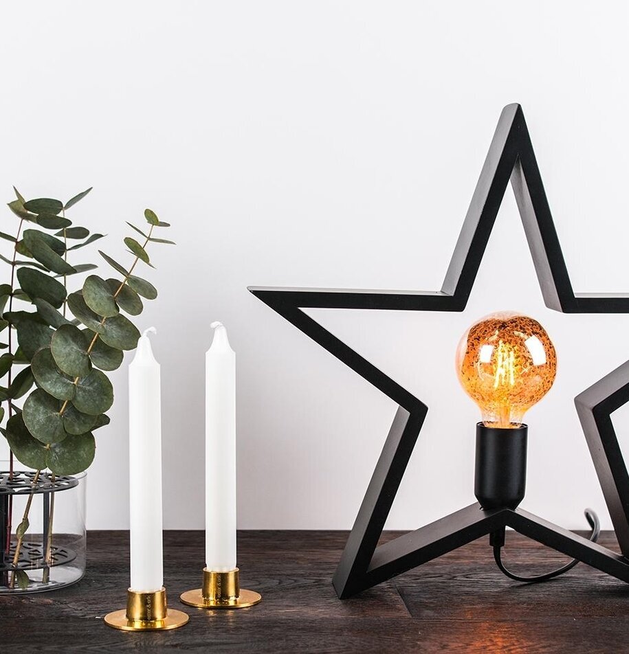 Trästjärna Svart från Havsö med ljus och eukalyptusblad