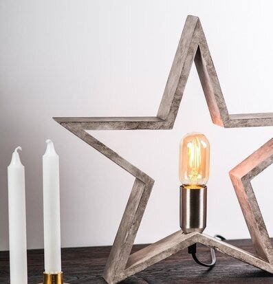 Trästjärna Natur från Havsö på ett mörkbetsat träbord