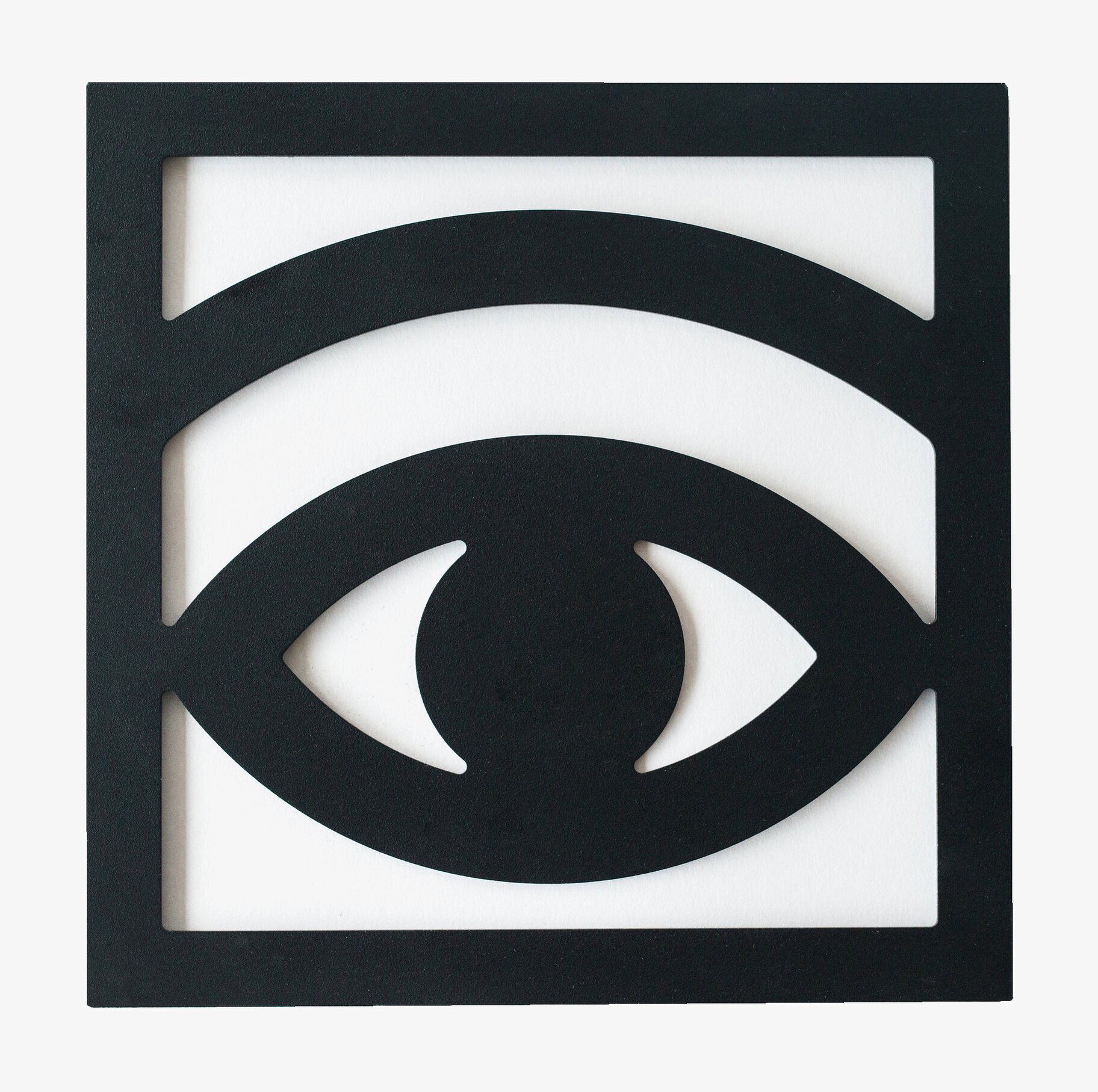 Ögon Cacao Trivet från Olle Eksell, svart med ögonmotiv