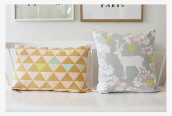 Kuddfodral Vincent Orange från Majvillan på vit bänk