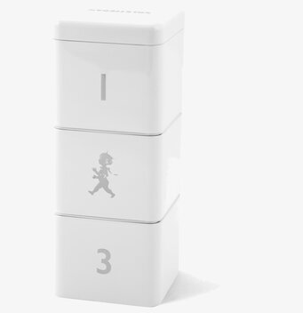 Bild av stilren vit cylinderformad burk för hemmet