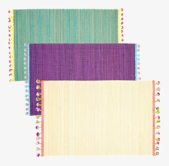 Bordsunderlägg Pom Pom från Rice i tre färgglada varianter