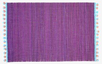 Bordsunderlägg Pom Pom från Rice med färgglada pom poms