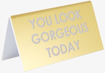 Desk Sign Clever Quotes från Rice mot en neutral bakgrund