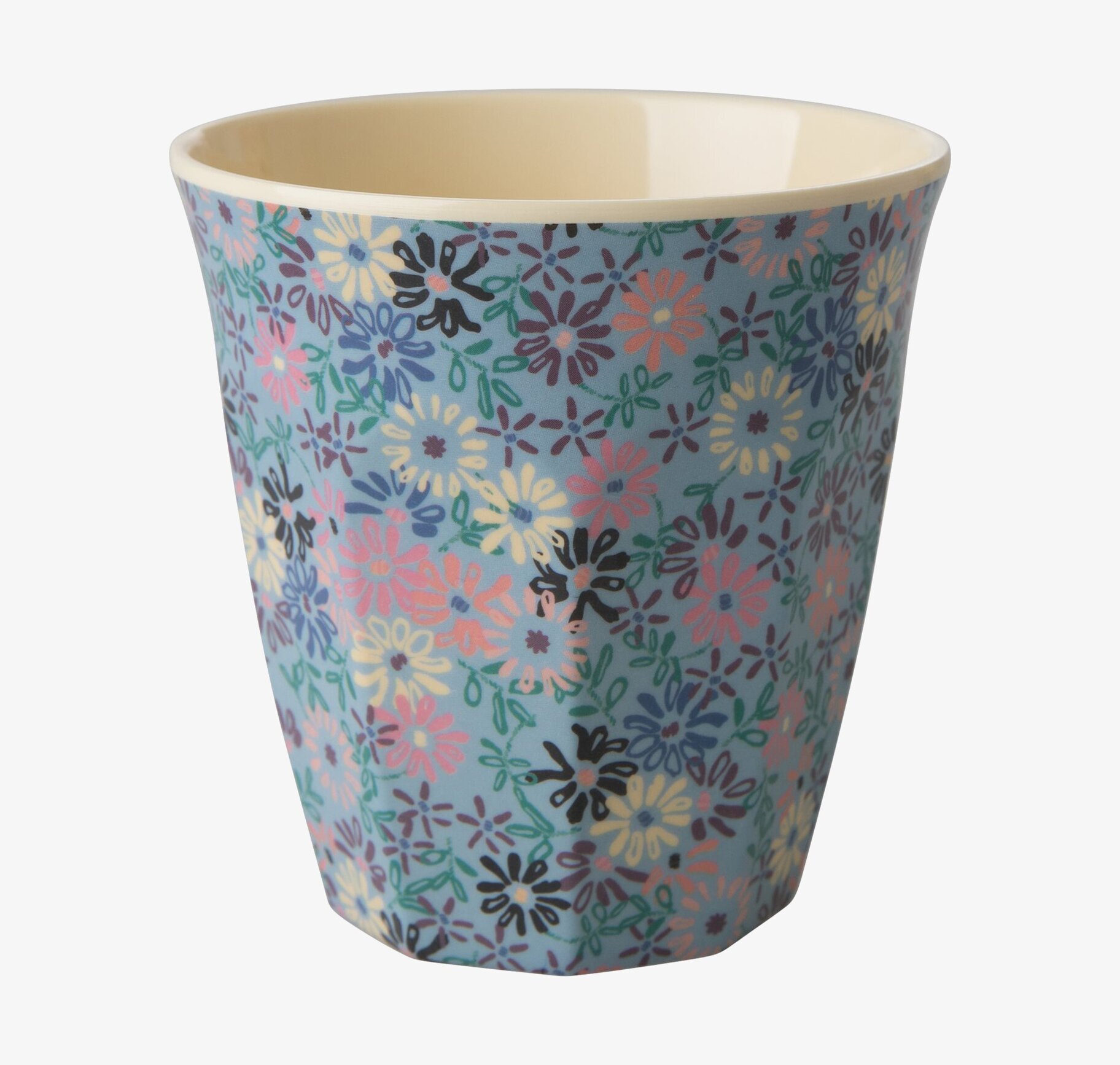 Bild av färgglad mugg med blommönster och pastelltoner