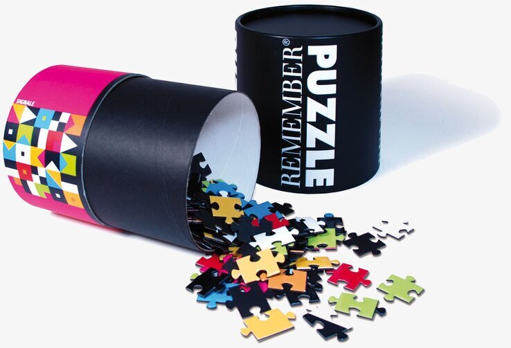 Pussel Signal från Remember med färgglada bitar och tub