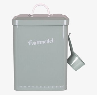 Foto av grön plåtburk för tvättmedel med handtag