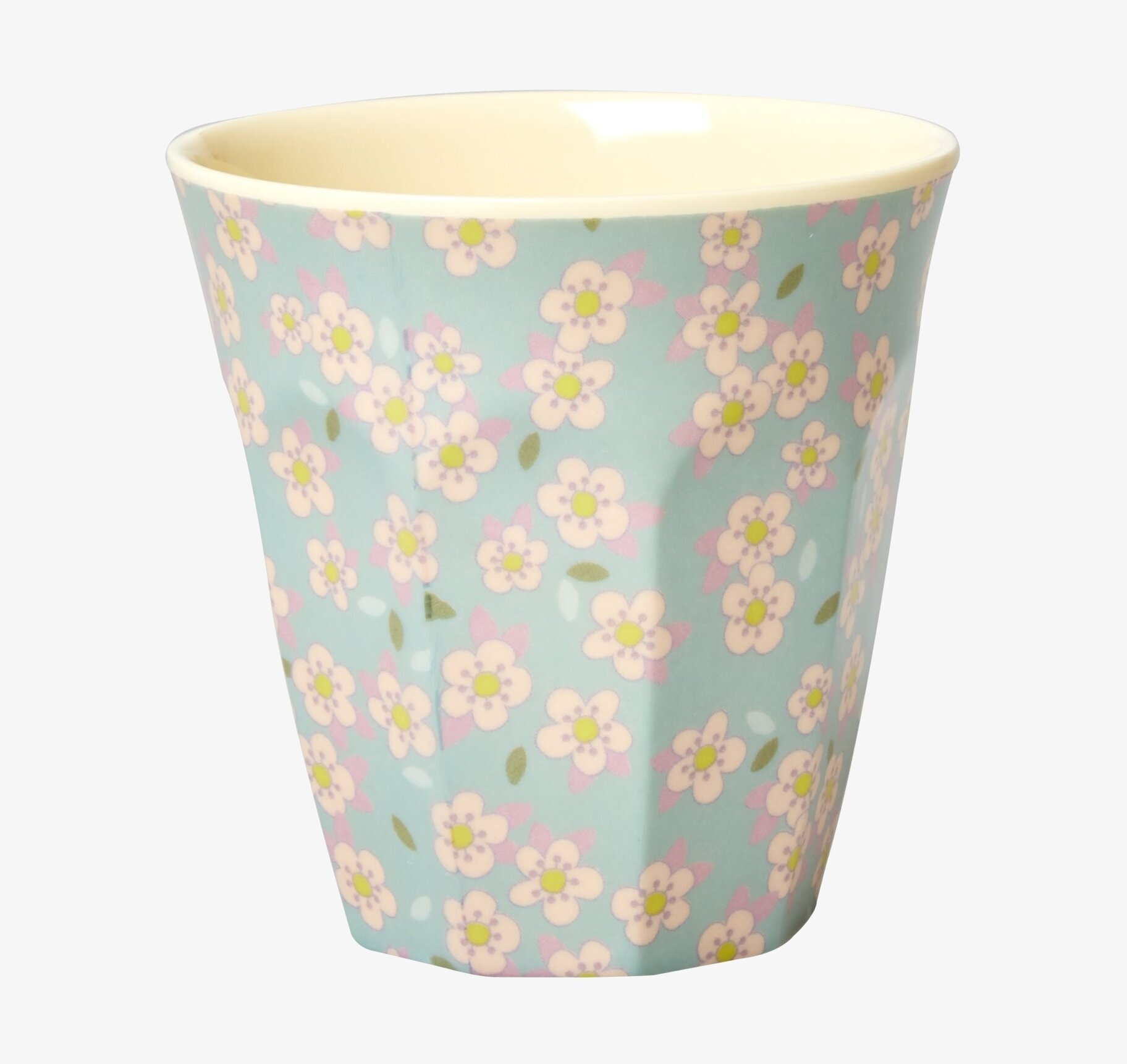 Bild av livfull mugg med blommönster och mintgrön ton