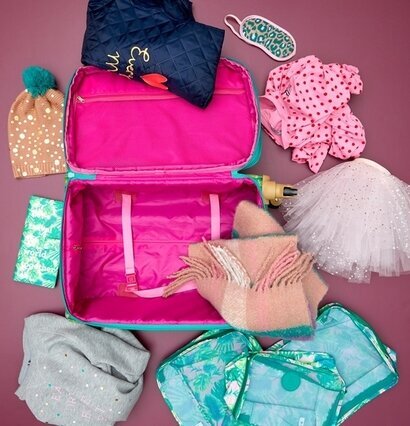 Packing Cubes Leopard Print från Rice i en öppen resväska