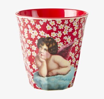 Bild på mugg med levande röd och vit blommig design