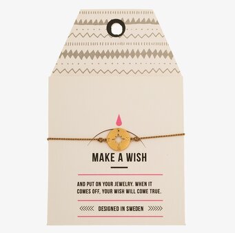 Armband Compass från Timi of Sweden på vit kartongetikett