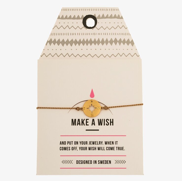 Armband Compass från Timi of Sweden på vit kartongetikett