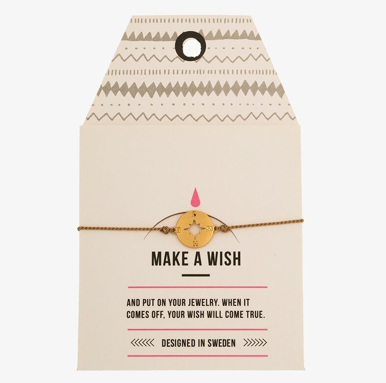 Armband Compass från Timi of Sweden på vit kartongetikett