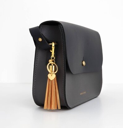 Reflextofs Golden Caramel Deluxe från Firefly på svart väska