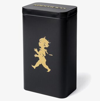 Bild av elegant svart plåtburk med gyllene detaljer