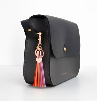 Reflextofs Disco Mix Rose Gold från Firefly fäst på väska