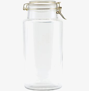 Foto av stilren glasburk med gyllene metallspänne