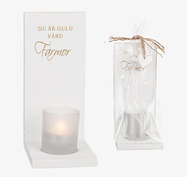 Foto av stilren väggljusstake med omtänksamt budskap