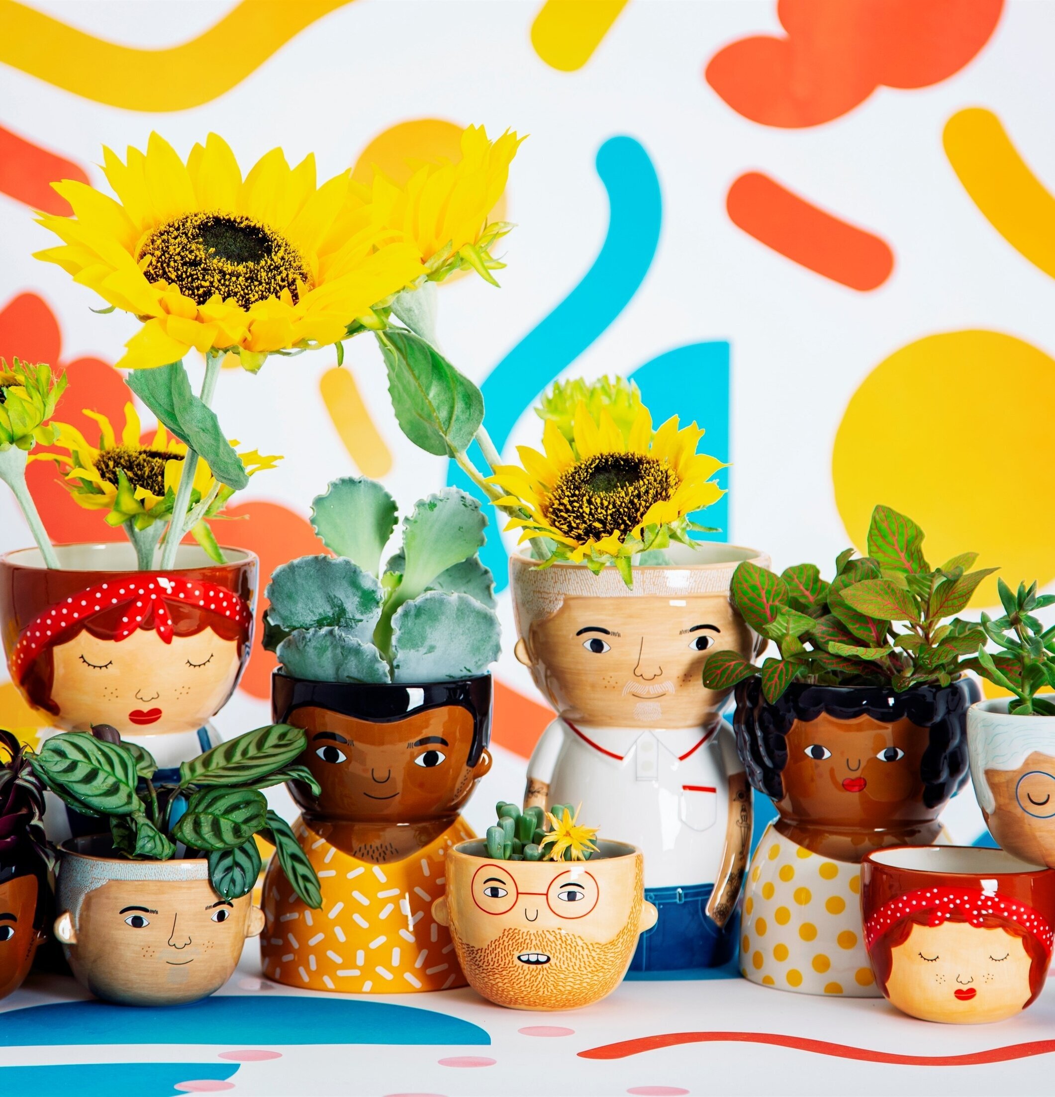 Kruka Mini Rose från Sass & Belle med ansiktsmotiv