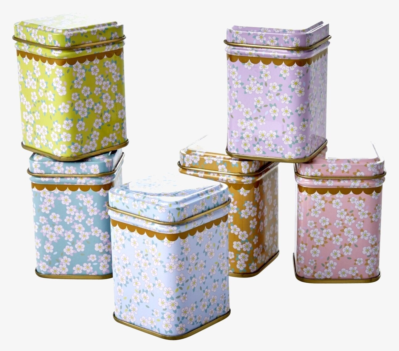 Bild av färgglada plåtburkar med blommiga mönster