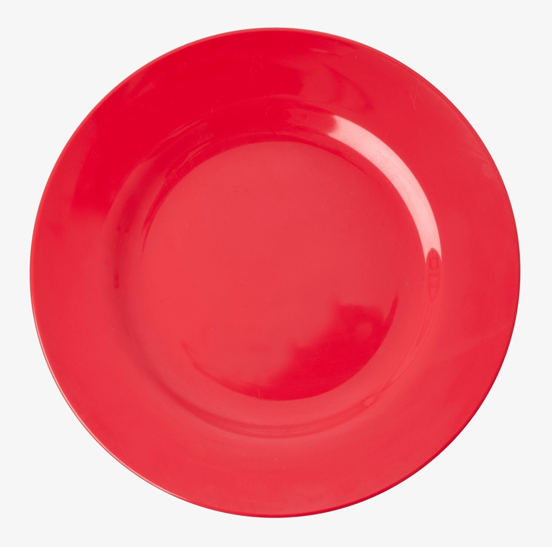 Tallrik Melamin Red Kiss från Rice i röd färg på ett bord