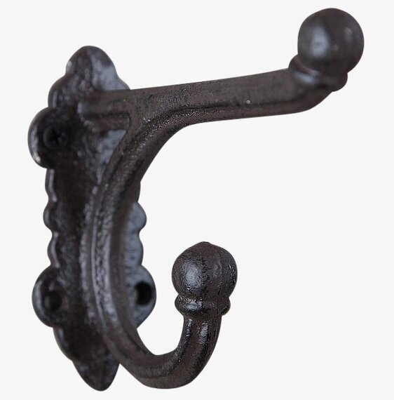 Väggkrok Gjutjärn från Silkflower mot vit vägg