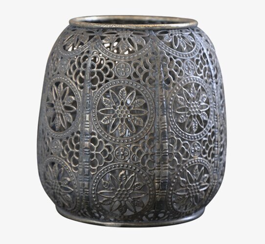 Bild av ljuslykta i antik brons med intrikata mönster