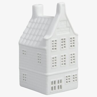 Foto av detaljrik ljuslykta i form av kanalhus