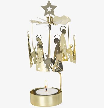 Bild av elegant änglaspel med julscen och värmeljus