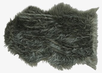 Konstgjord Lammfäll Grön från Chic Antique i en soffa