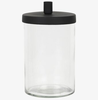 Bild av ljusstake med glasbehållare och svart lock