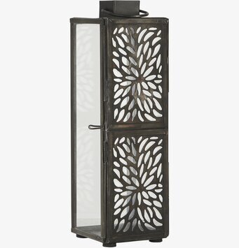 Bild av ljuslykta i glas och metall med mönster