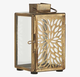 Bild av ljuslykta i metall med dekorativa detaljer