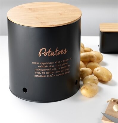 Bild av stilren plåtburk med potatis och trälock
