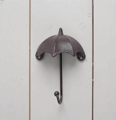 Krok Paraply från Multi Agentur monterad på vit trävägg