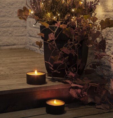 LED Ljus Torch Candle från Star Trading på ett trädäck