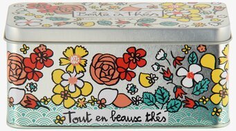 Bild av färgglad plåtburk för tepåsar med blommotiv