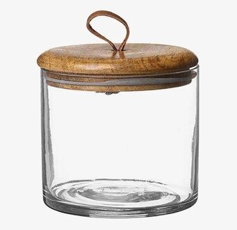 Bild av stilren glasburk med trälock och läderdetalj