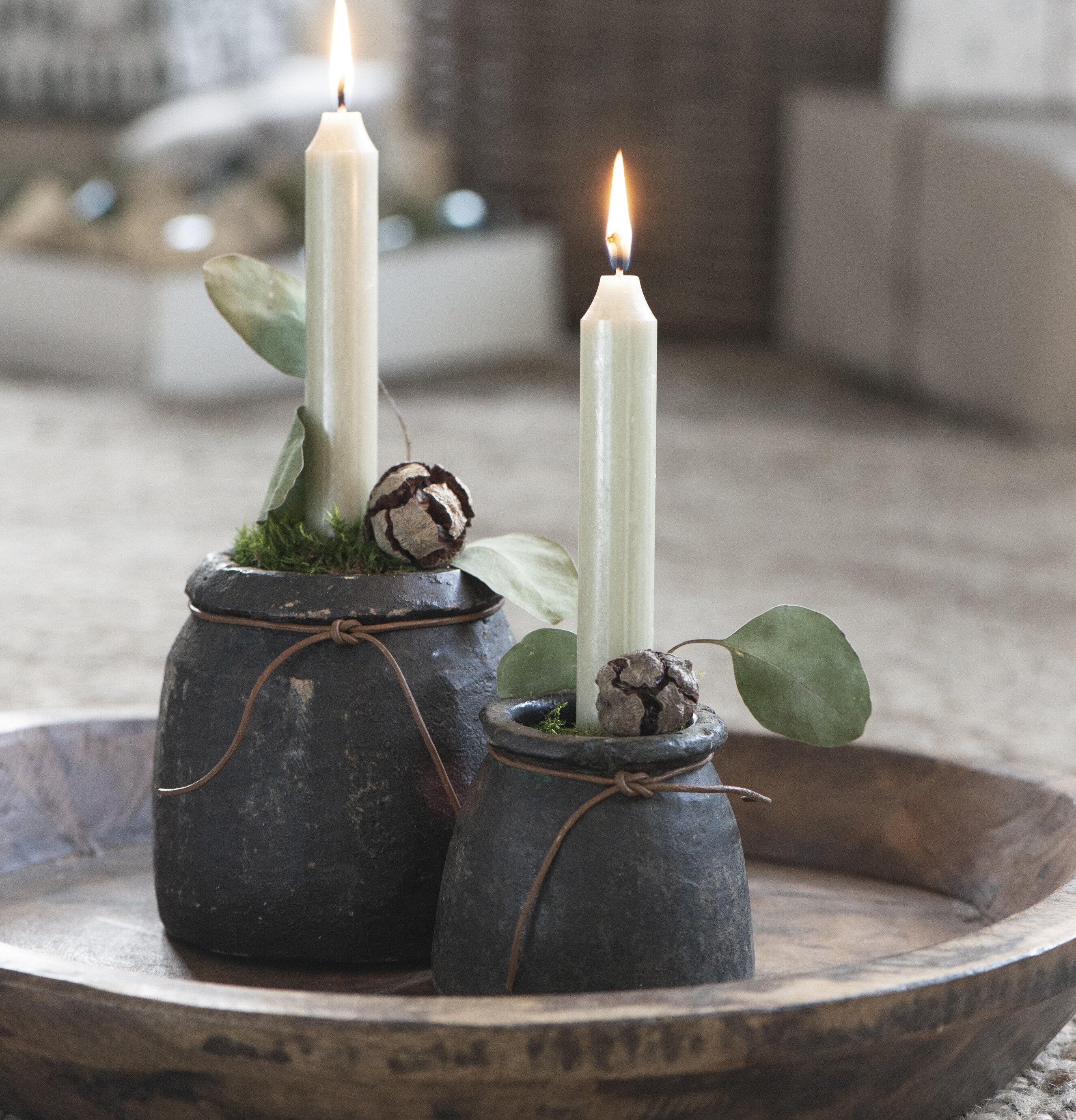 Stenkruka Unika från IB Laursen på träbricka med tända ljus