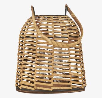 Bild av ljuslykta i rotting med glas och metall