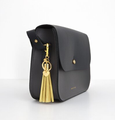 Reflextofs Lemon/Gold Deluxe från Firefly på svart väska