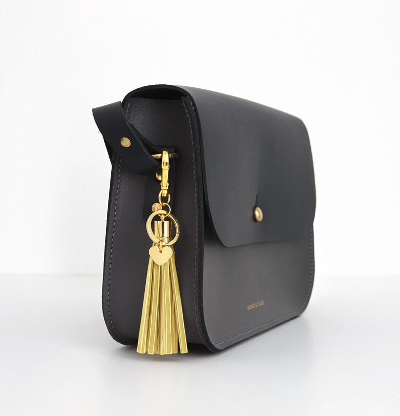 Reflextofs Lemon/Gold Deluxe från Firefly på svart väska