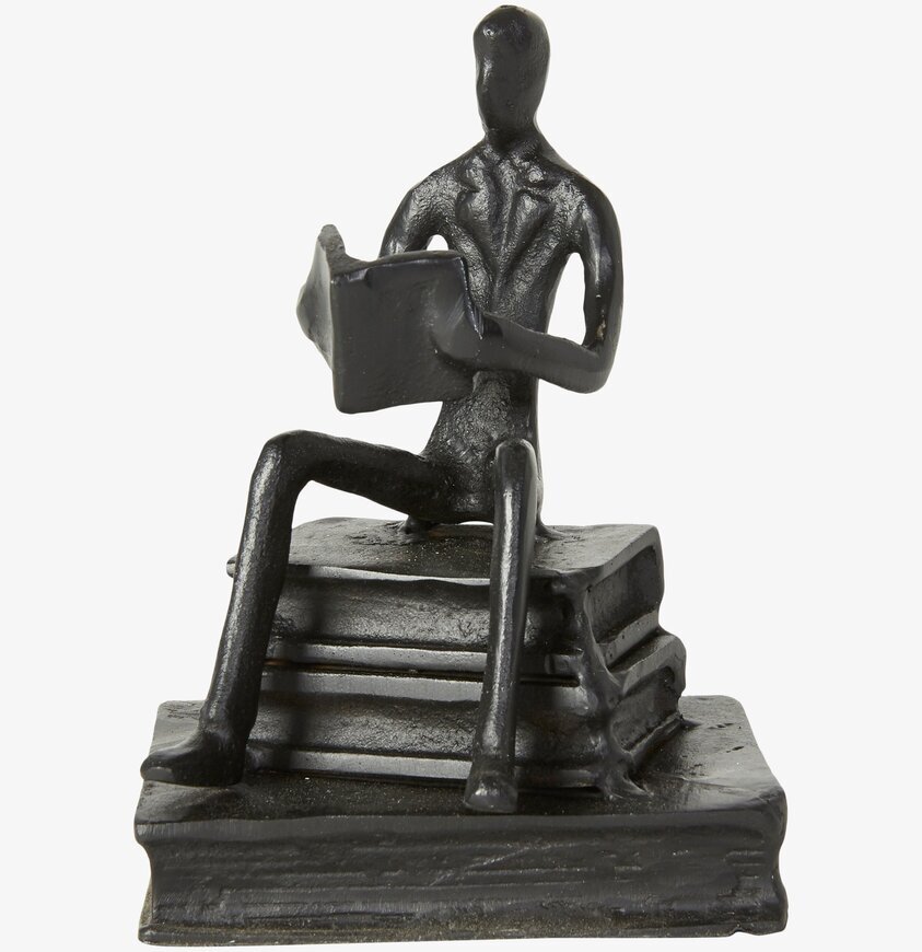 Figurin Läsande Man från Speedtsberg, stiliserad och svart