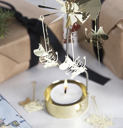 Foto av förtrollande änglaspel med Mumin-tema