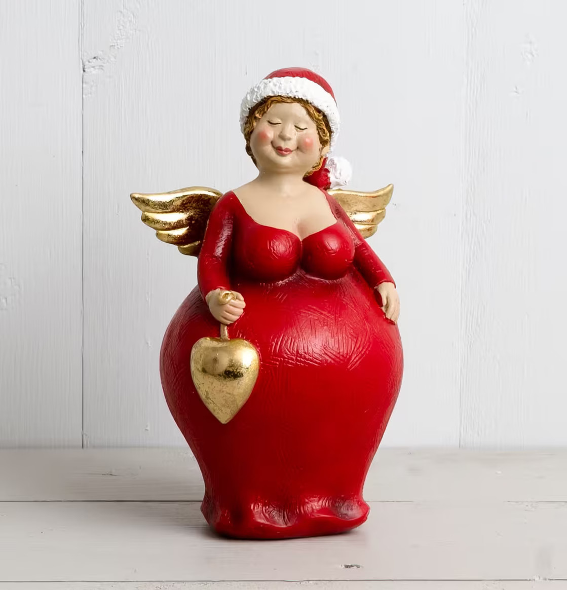 Julängel Yppig M från Multi Agentur i klarröd klänning