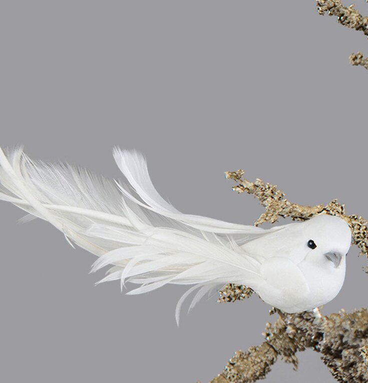 Duva Clip Deluxe från A Lot Decoration monterad på en gren